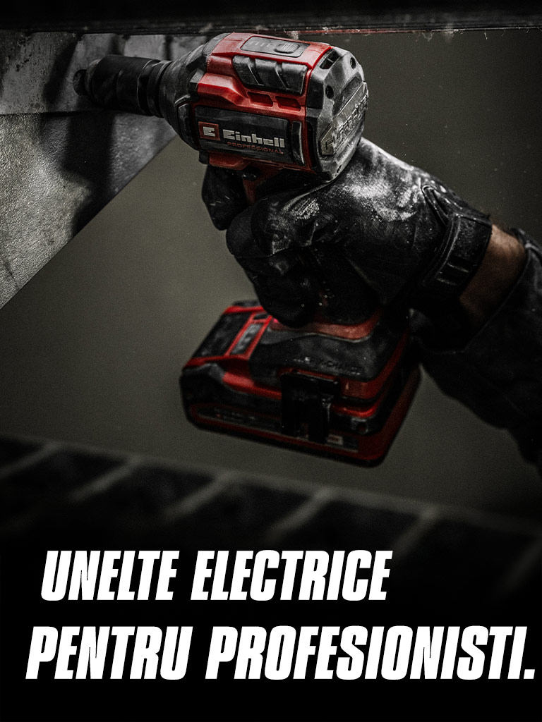 A hand holds a red cordless impact wrench being used on a metal beam, with the text "Power Tools for Pros".