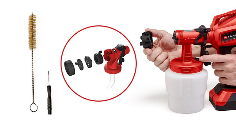 A paint sprayer with accessories, including cleaning tools, nozzles, and spare parts.